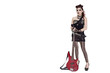 Photo: Beautiful young punk woman standing with guitar over white background Beautiful young punk woman standing with guitar over white background