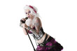 Photo: Portrait of beautiful young woman wearing wig while singing with microphone over white background Portrait of beautiful young woman wearing wig while singing with microphone over white background