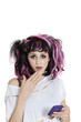 Photo: Portrait of shocked young woman with mobile phone over white background Portrait of shocked young woman with mobile phone over white background