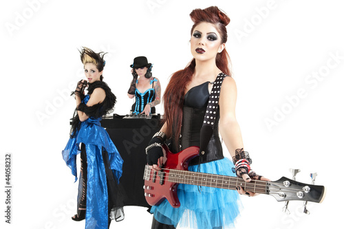 Photo: Beautiful all female rock band over white background Beautiful all female rock band over white background