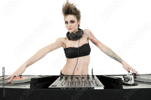 Photo: Portrait of beautiful young female DJ wearing strapless lingerie over white background Portrait of beautiful young female DJ wearing strapless lingerie over white background