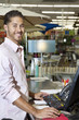 Photo: Portrait of a happy store clerk in shop Portrait of a happy store clerk in shop