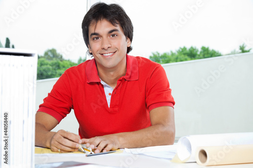 Foto: Architect Working On Blueprint Architect Working On Blueprint
