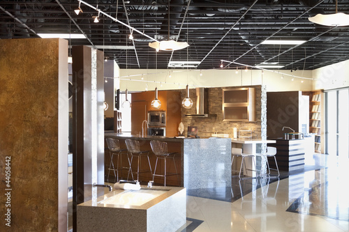 Photo: Empty modern kitchen model in store Empty modern kitchen model in store