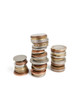 Close-up of stack of coins balancing over white background