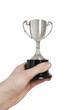 Cropped image of man's hand holding winning trophy over white background