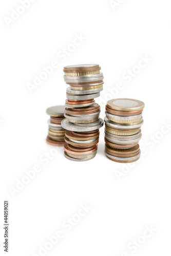 Photo: Stack of coins over white background Stack of coins over white background
