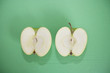 Photo: Sliced green apple over green background Sliced green apple over green background