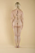 Rear view of a nude woman with a crack on spine standing over colored background