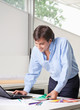Male Interior Designer Using Laptop