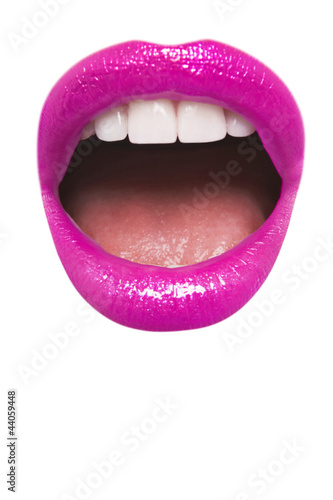 Photo: Close-up view of female wearing pink lipstick with mouth open over white background Close-up view of female wearing pink lipstick with mouth open over white background