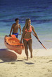 couple at the beach with their kayak