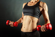 Woman with dumbbells