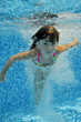Happy underwater child in swimming pool, summer vacation, sport