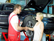 Female customer and mechanic shaking hands for good deal