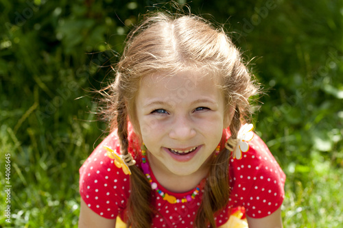 Photo: Portrait of laughing girl with pigtails Portrait of laughing girl with pigtails