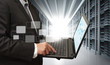 business man use notebook in server room