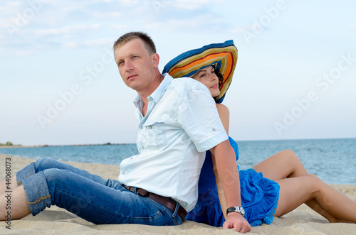 Photo: Couple using each other as backrests Couple using each other as backrests