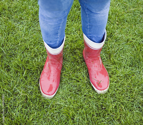 Photo: Teenage girl wearing red rubber boots Teenage girl wearing red rubber boots