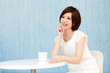 Beautiful young business woman drinking tea