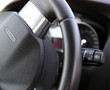 Car dashboard : An illuminated car dashboard in red and black