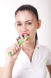 Young attractive girl cleaning her teeth and smiling
