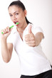 Young attractive girl cleaning her teeth