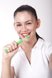 Young attractive girl cleaning her teeth