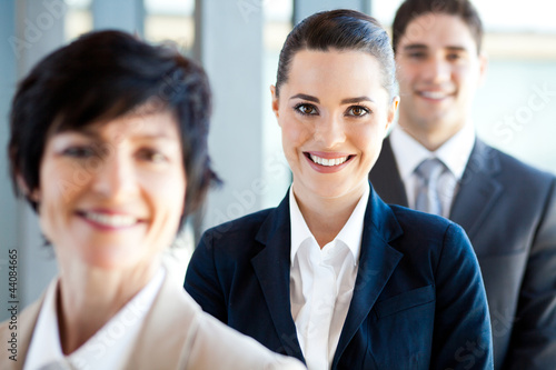 Photo: pretty businesswoman and co-workers portrait pretty businesswoman and co-workers portrait