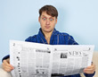 Man reads a newspaper with a admiration