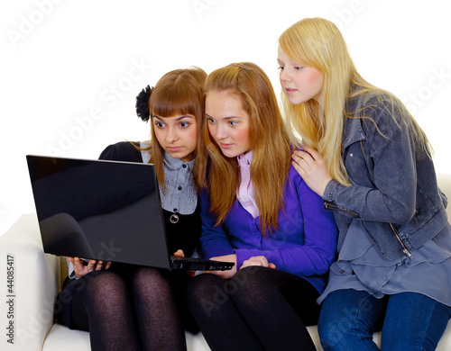 Photo: Female teenagers with a laptop Female teenagers with a laptop