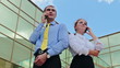 Video: Businesspeople standing back to back and calling by cellphones Businesspeople standing back to back and calling by cellphones