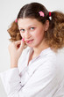 girl in a light pajamas sits with sugar candy
