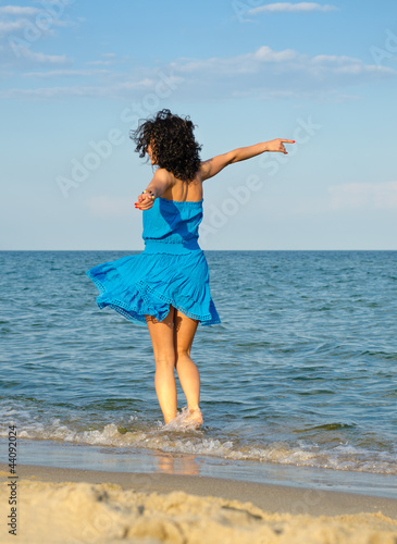 Photo: Woman dancing in the sea Woman dancing in the sea