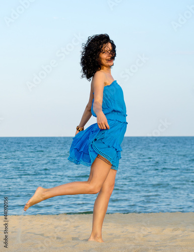 Photo: Woman posing at the beach Woman posing at the beach
