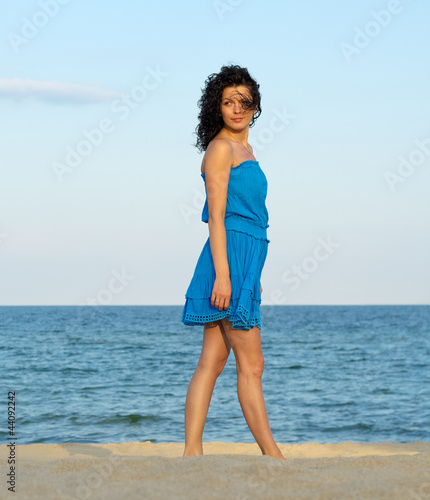Photo: Woman posing on a beach Woman posing on a beach