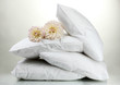 pillows and flowers, on grey background