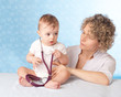 Photo: Female doctor and baby patient. Female doctor and baby patient.
