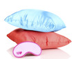Sleeping mask and pillows isolated on white