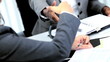 Handshake of multi ethnic businesswoman in modern workplace