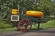 Carriage with cheese and a weighing machine