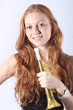 Pretty redhead woman with a trumpet