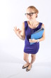 Pretty redhead woman holding a folder, doing the OK sign