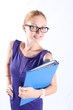 Pretty redhead woman with eyeglasses holding a folder