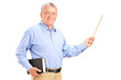 A male teacher holding a wand and book