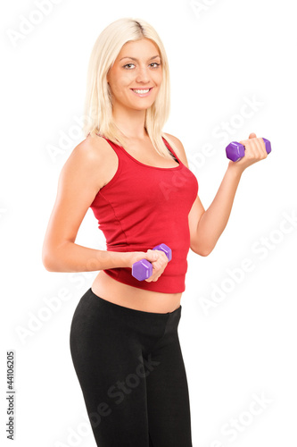 Photo: Attractive young woman exercising with weights Attractive young woman exercising with weights