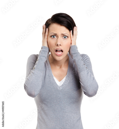 Photo: Confused woman puts her hands on the head, isolated on white Confused woman puts her hands on the head, isolated on white