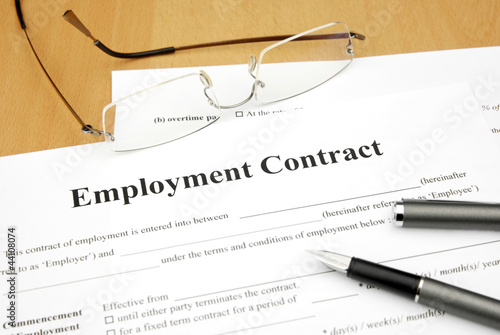 Photo: employment contract form on a desk employment contract form on a desk