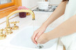 Foto: Beautiful young woman washing her hands Beautiful young woman washing her hands