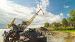 Floating crane digging sand on river side